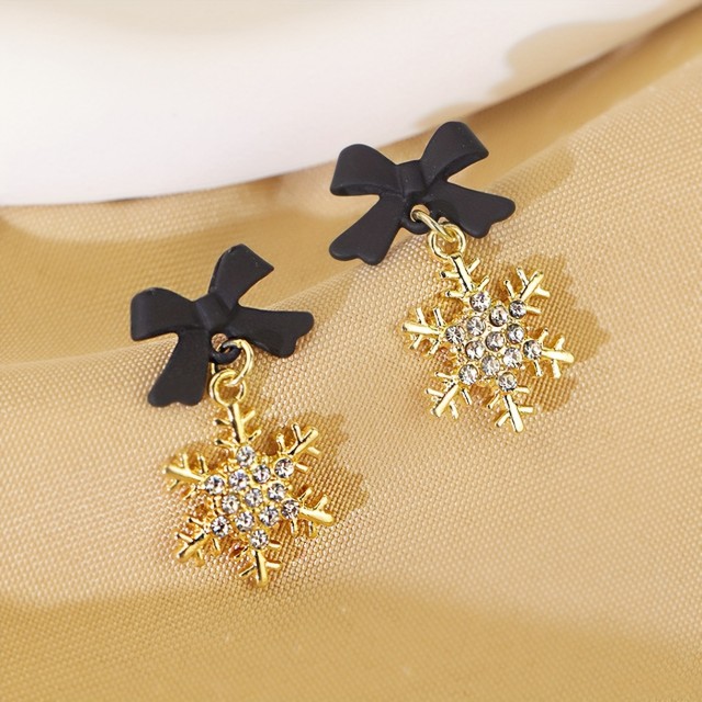 Praznični uhani s črno pentljo in snežinkami