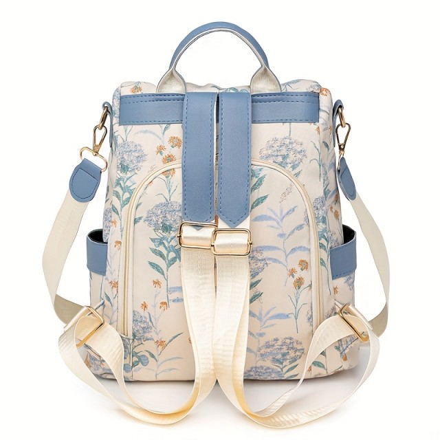 Ženski nahrbtnik v modri barvi s cvetličnim potiskom