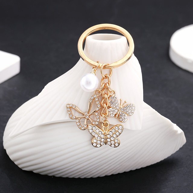 Obesek za ključe s 3 metuljčki zlate barve