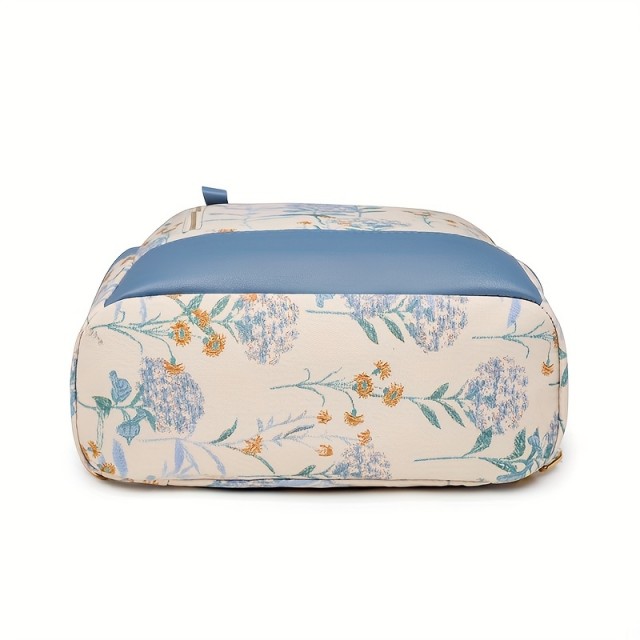 Ženski nahrbtnik v modri barvi s cvetličnim potiskom