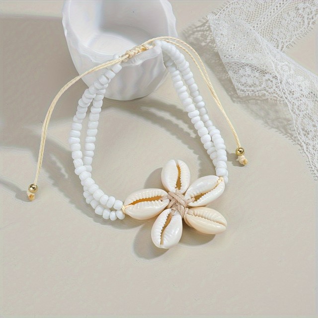 Čudovita zapestnica za nogo s školjkastim cvetom