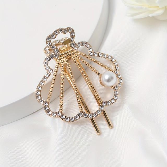 Elegantna kovinska sponka za lase v obliki školjke