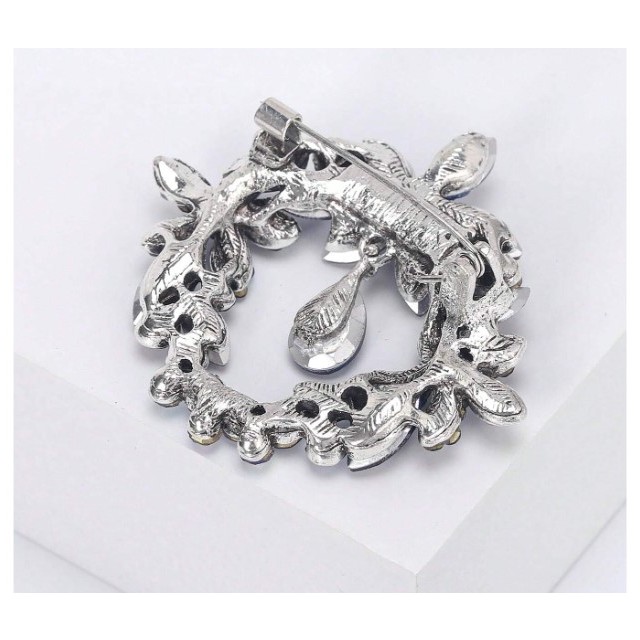 Okrogla broška z modrimi kristali