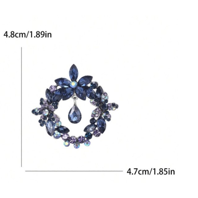 Okrogla broška z modrimi kristali