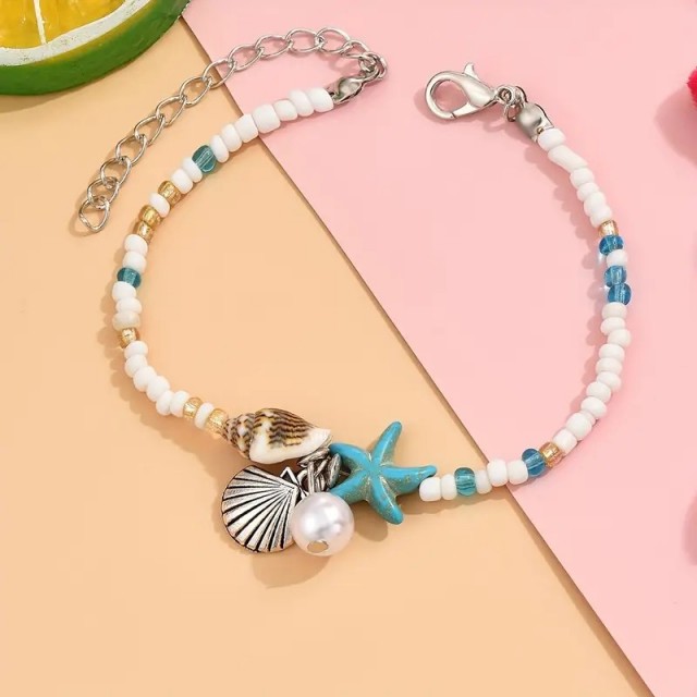 Poletna zapestnica za nogo s školjkami in modro zvezdico