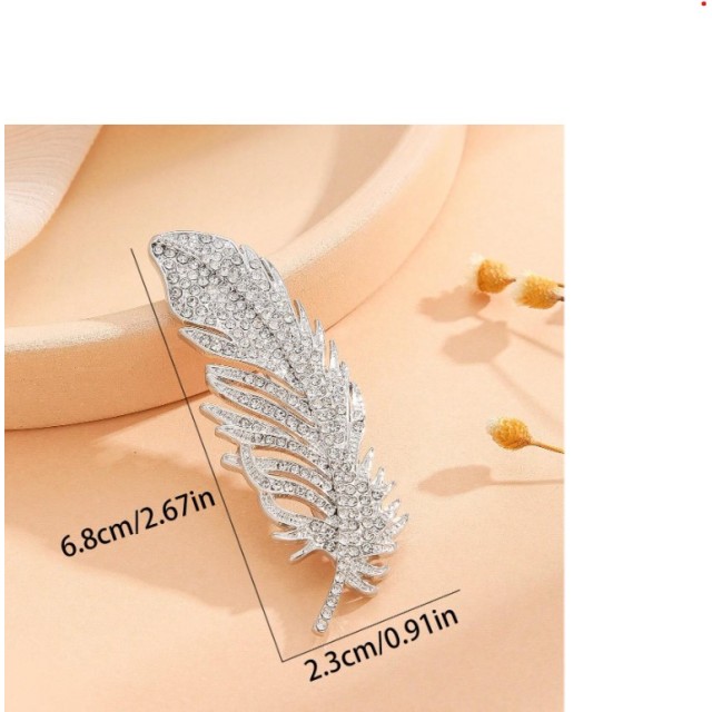 Elegantna broška v obliki peresca 