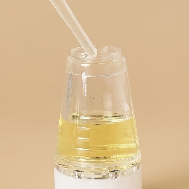 Mini aplikator olja in masažna krtača za nego las
