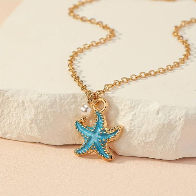 Zapestnica zlate barve z modro morsko zvezdico