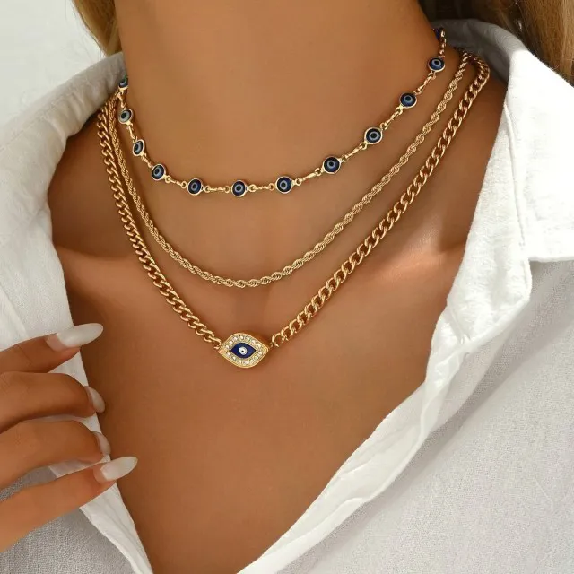 Tridelna ogrlica v zlati barvi z Evil eye 