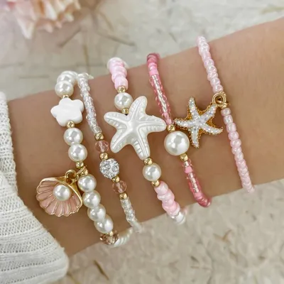 5 delni boho set zapestnic v roza barvi s školjkami