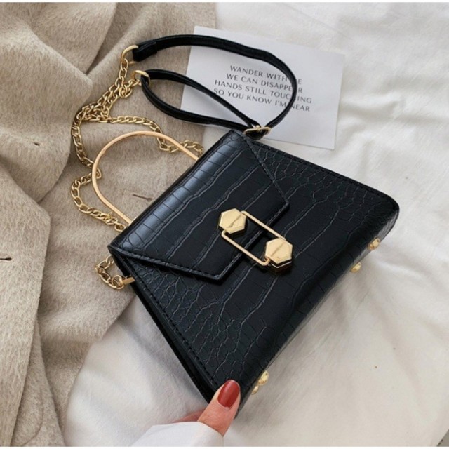 Elegantna torbica zlato-črne barve