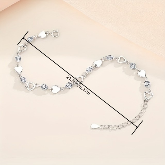 Elegantna zapestnica z motivom src v srebrni barvi