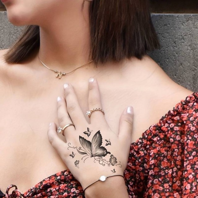 Tatu nalepka črne barve, metulji